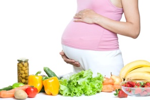pregnant woman belly with vegetables and fruits